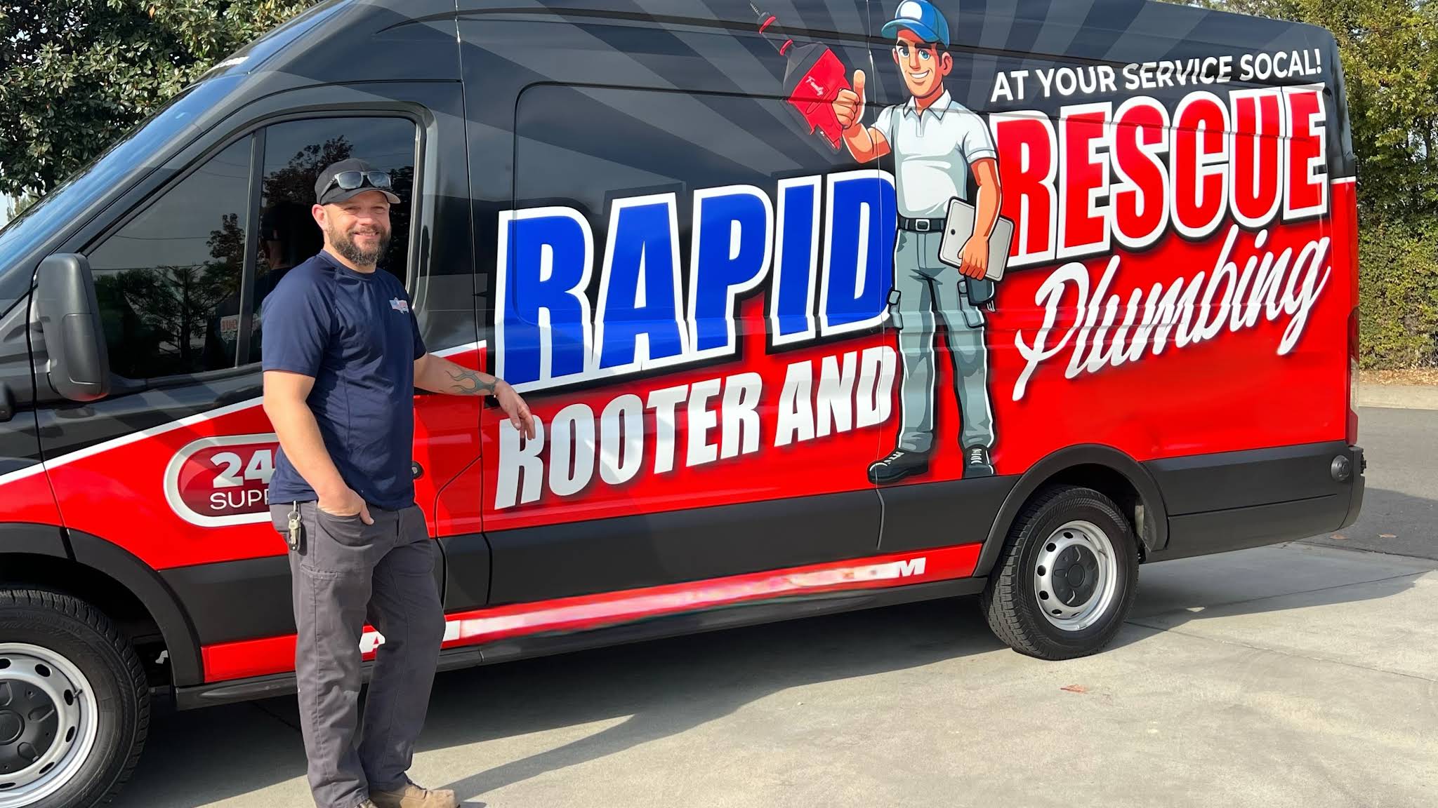 Rapid Rescue Rooter and Plumbing team member beside the company service van.